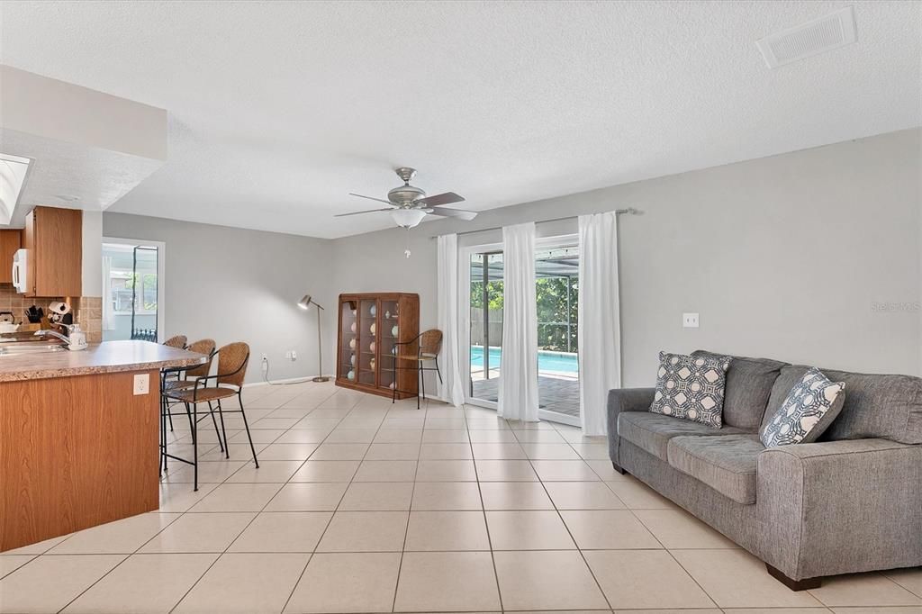 Family room with sliders to the pool