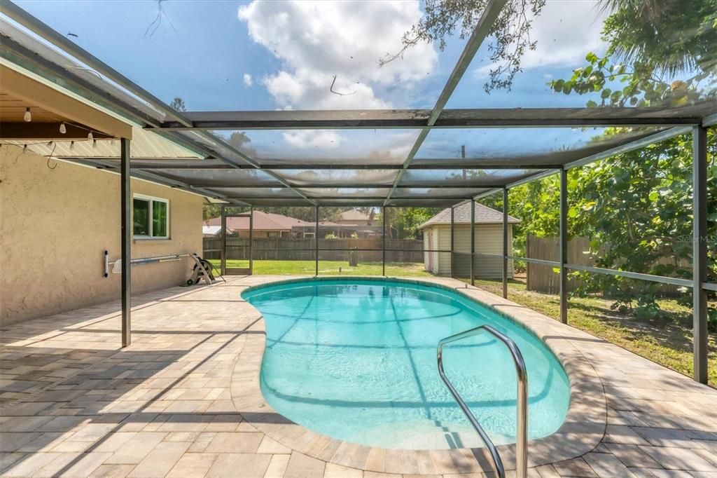 Screen enclosed lanai with paver pool deck