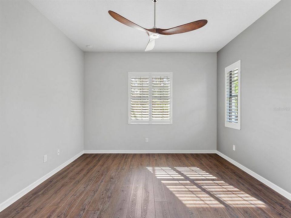 Primary bedroom with luxury vinyl flooring