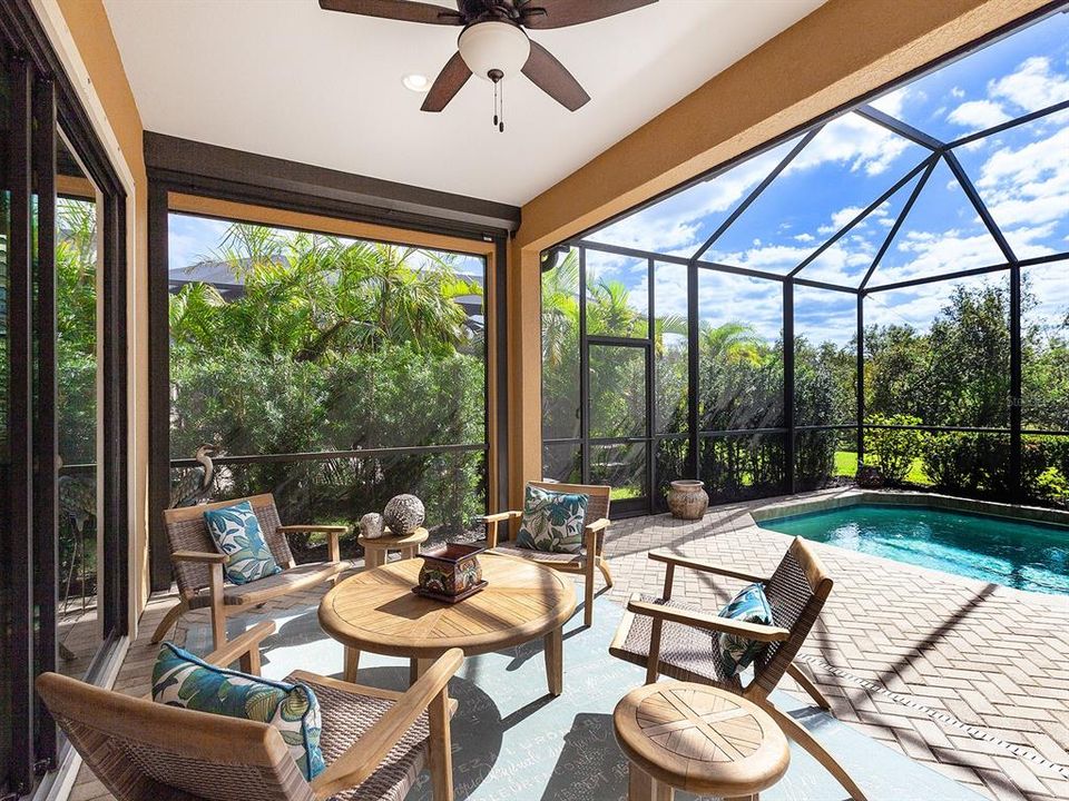 Covered lanai opening to the pool