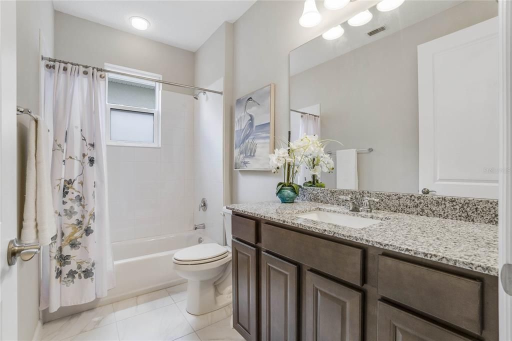 Guest Bathroom w/ granite top vanity & tub/shower combo