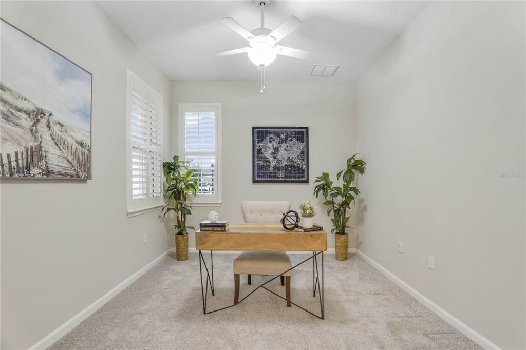 10' x 12' Den/office w/ Plantation style shutters & a ceiling fan