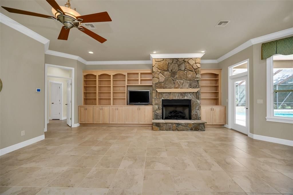 Family room with Glass door leading to summer kitchen and screened lanai