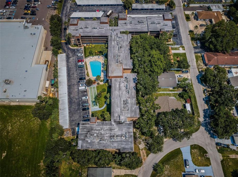 An overhead view of the condo, highlighting its position within the community and the surrounding amenities and landscape.