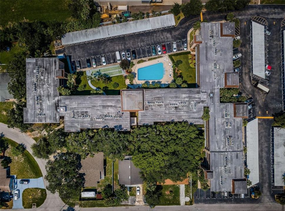 An aerial view showing the condo and its immediate surroundings, providing a clear picture of the property’s layout and neighboring features.