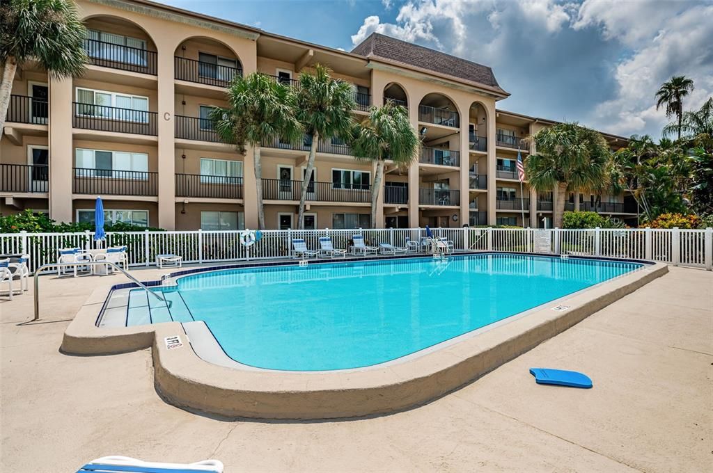 Overhead shot of the condo, highlighting the swimming pool area as a relaxing retreat within the community.