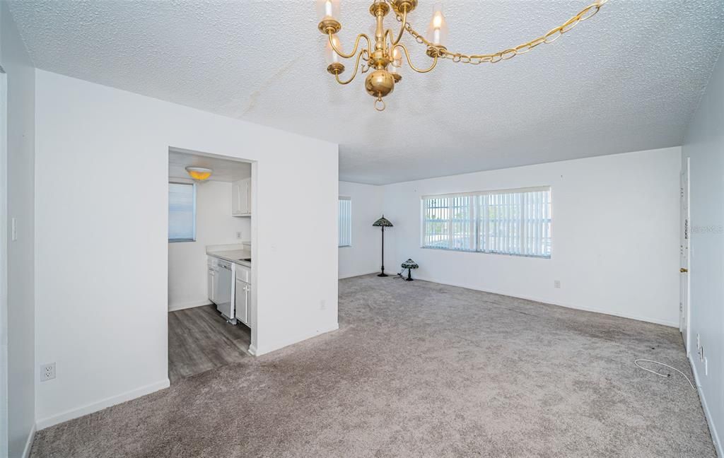 This dining room provides a view into the well-appointed kitchen, allowing for convenient access and a harmonious flow between dining and meal preparation.