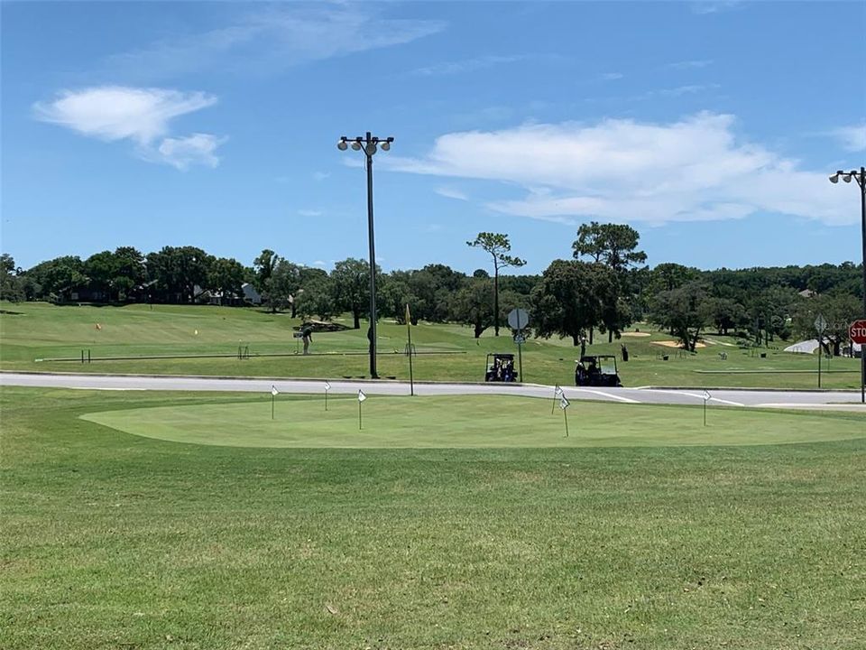 Putting green at entrance to community