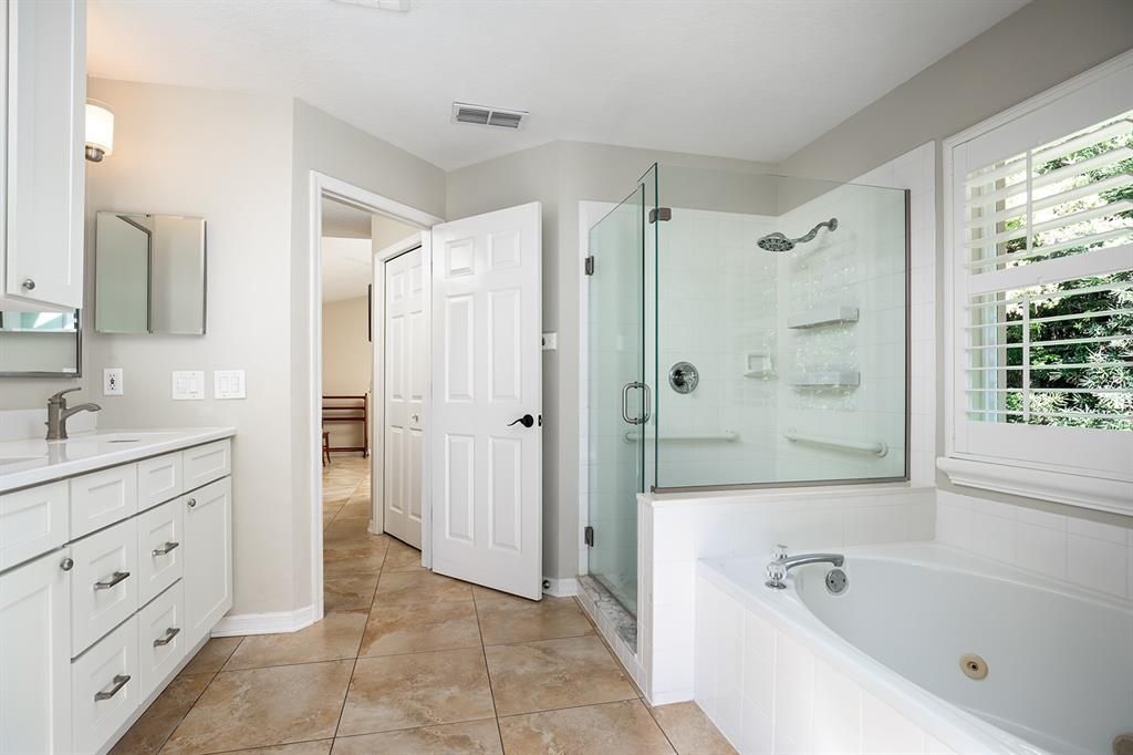 Frameless glass shower door & spa like feel in the primary bath