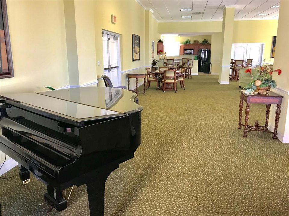 baby grand piano in club room