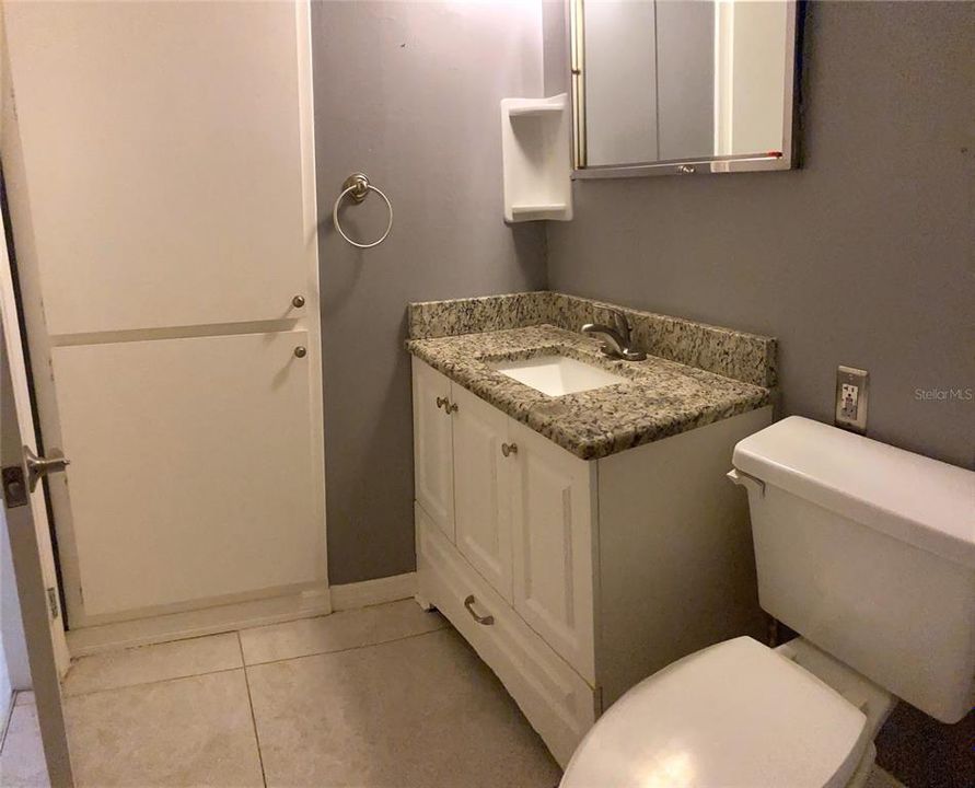 Bathroom with linen closet.