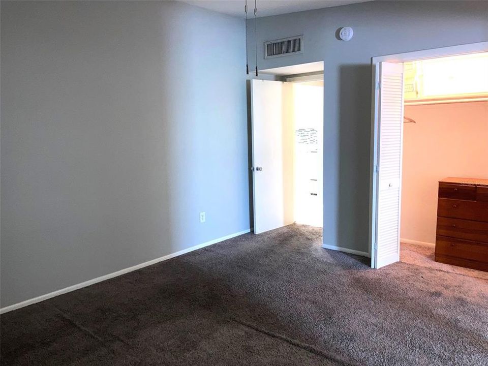 Bedroom is carpeted, includes a roomy wall closet.