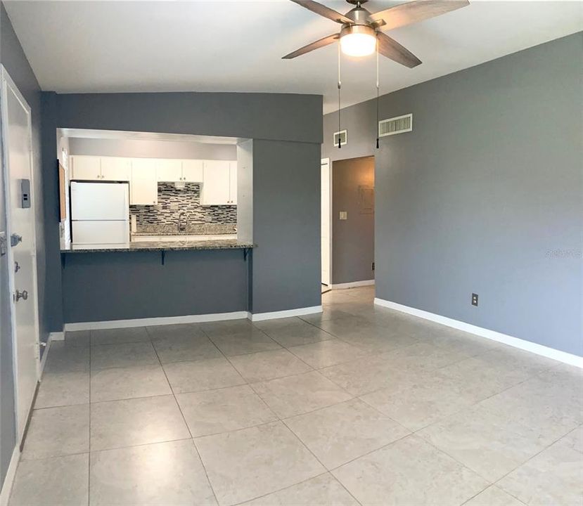 Living room area features a pass through counter into the kitchen.