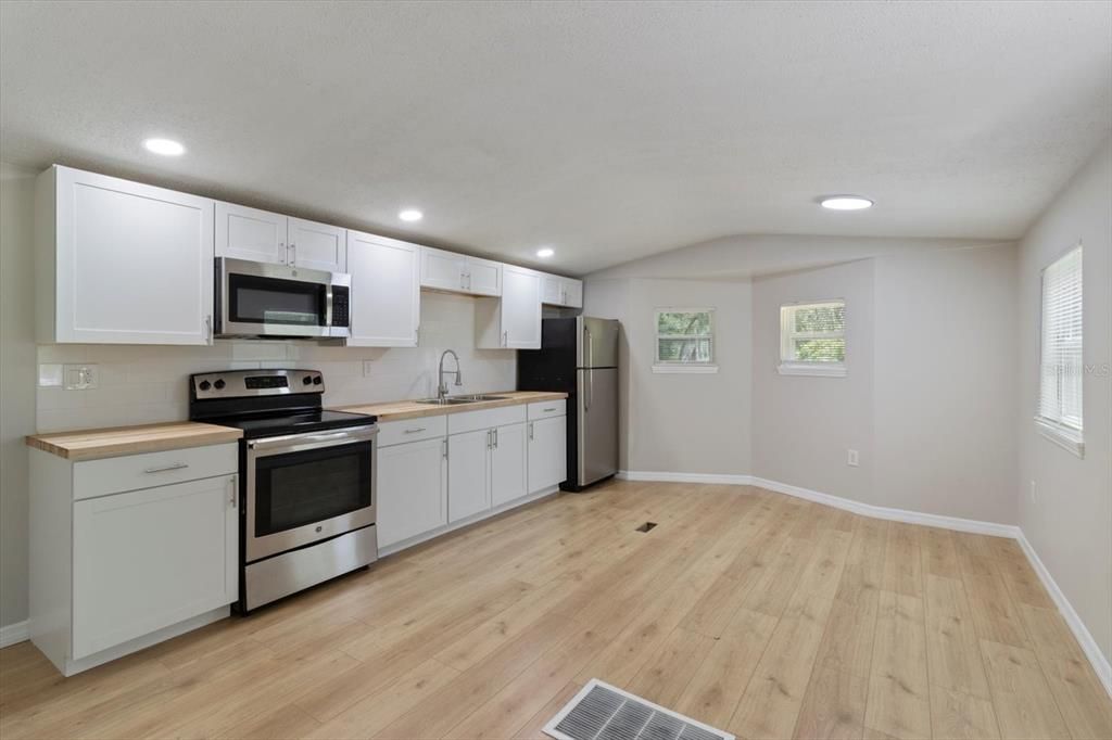 NEW Kitchen w/ NEW White Shaker Cabinets, NEW Butcher Block Countertops, NEW White Subway Tile Backsplash, NEW Recessed Lighting & Newer Stainless Steel Appliances