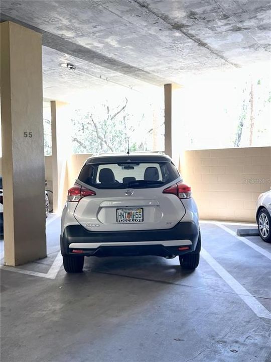 Covered parking in garage in assigned space, car NOT included in sale.