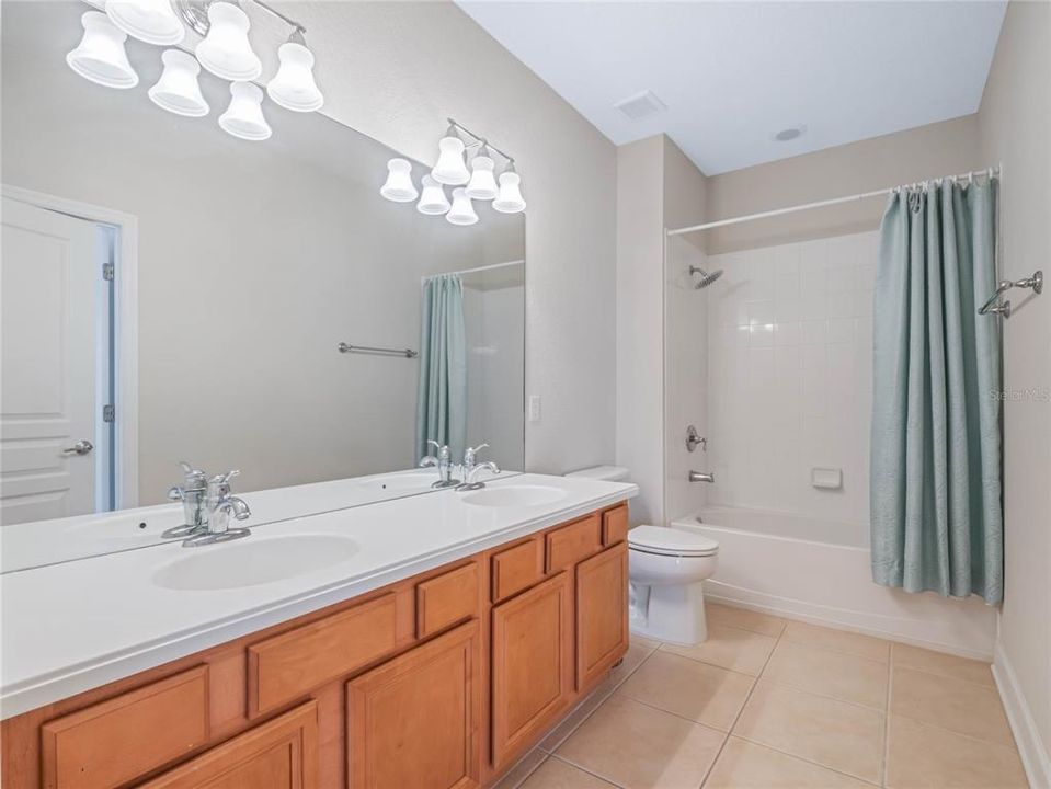 Upstairs full bathroom with dual sinks access from hall and bedroom #3