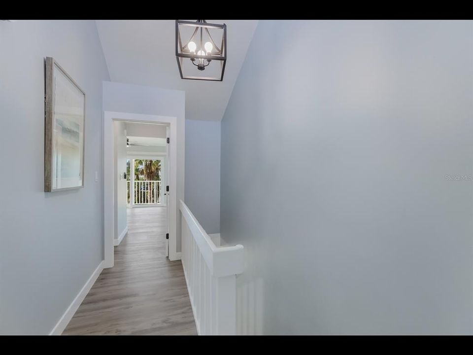 Third floor looking into primary bedroom