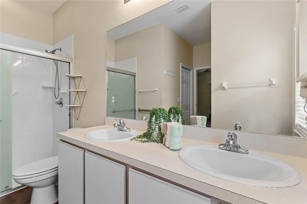 Primary Bathroom features dual sinks and a built in dryer