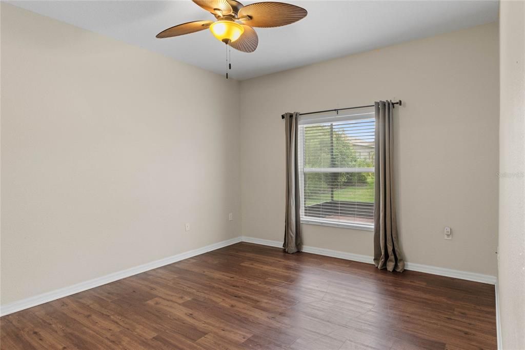 Primary Bedroom Suite overlooks the backyard