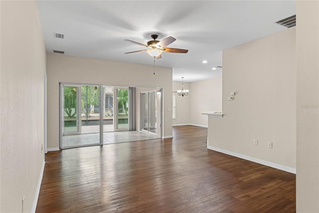 Living Room features Triple Glass Sliding Doors leading to the Florida Room