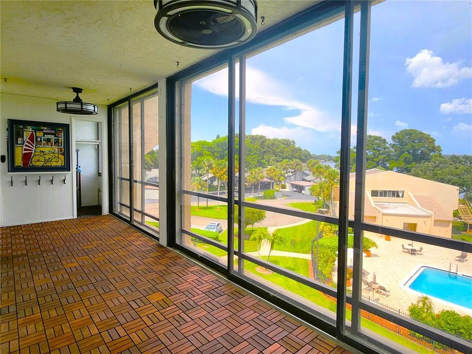 Screened Balcony/Lanai includes a storage room and 2 ceiling fans