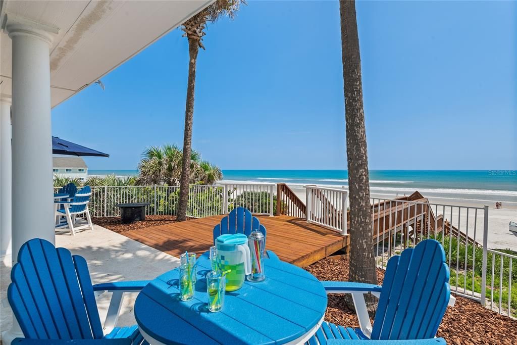 Main floor patio with walk way to beach.