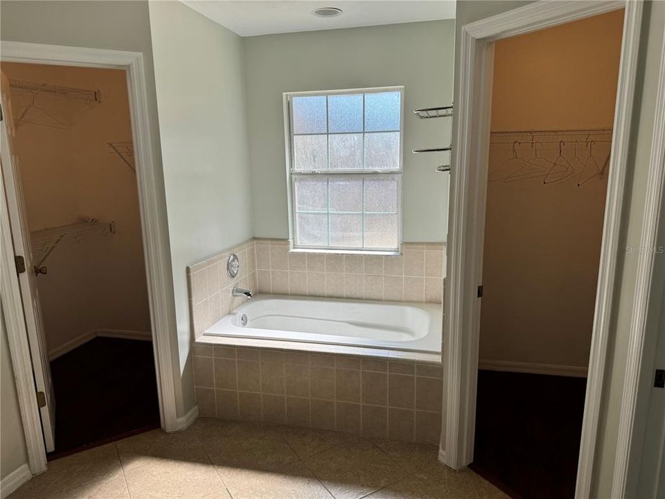 Primary Bath with Double Walk In Closets