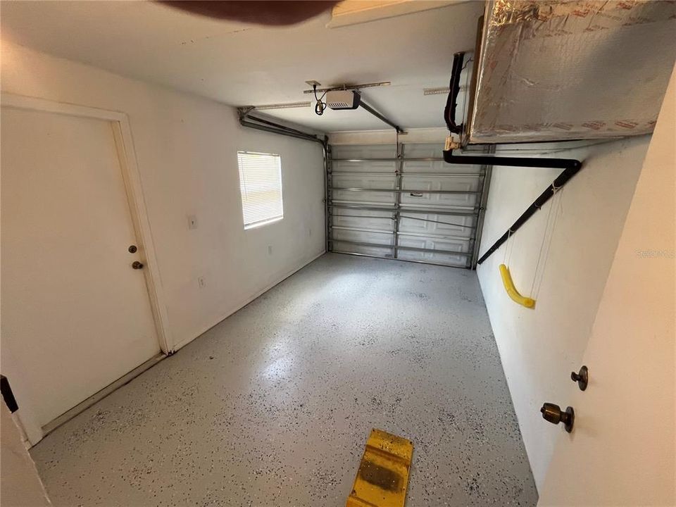 One car Garage with finished floor and ext. door.