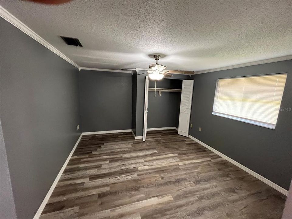 Primary Suite with reach in closet and un suite bath.