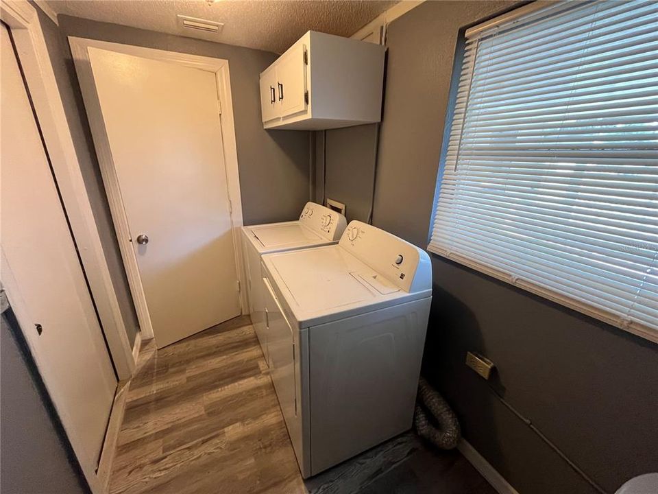 Inside laundry room off the kitchen and garage