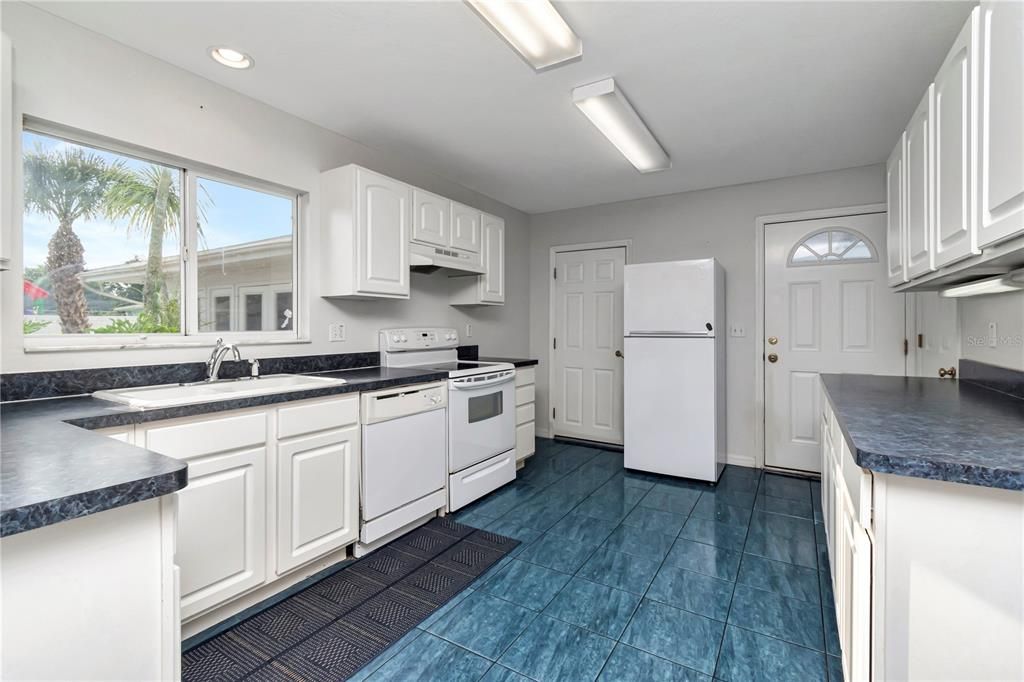 In-law suite/ADU kitchen with lock-off door to main (left) and private entrance door (right).