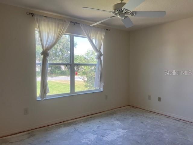 Front Guest Bedroom - exposed concrete flooring