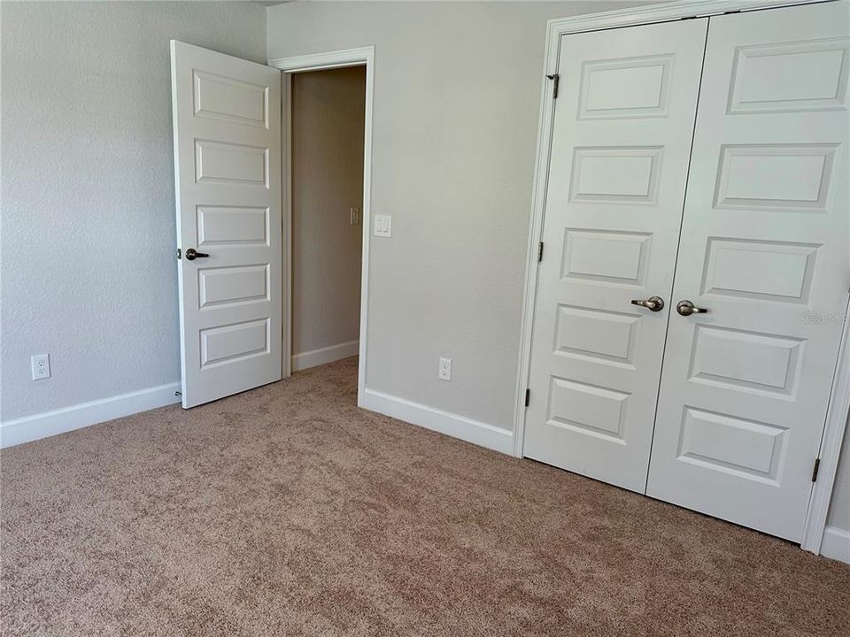 Bedroom 2 entry and closet doors