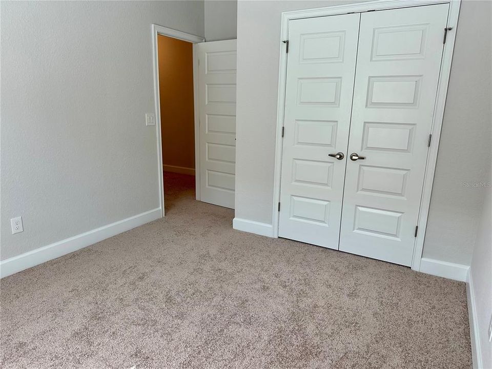 Bedroom three entry and closet door