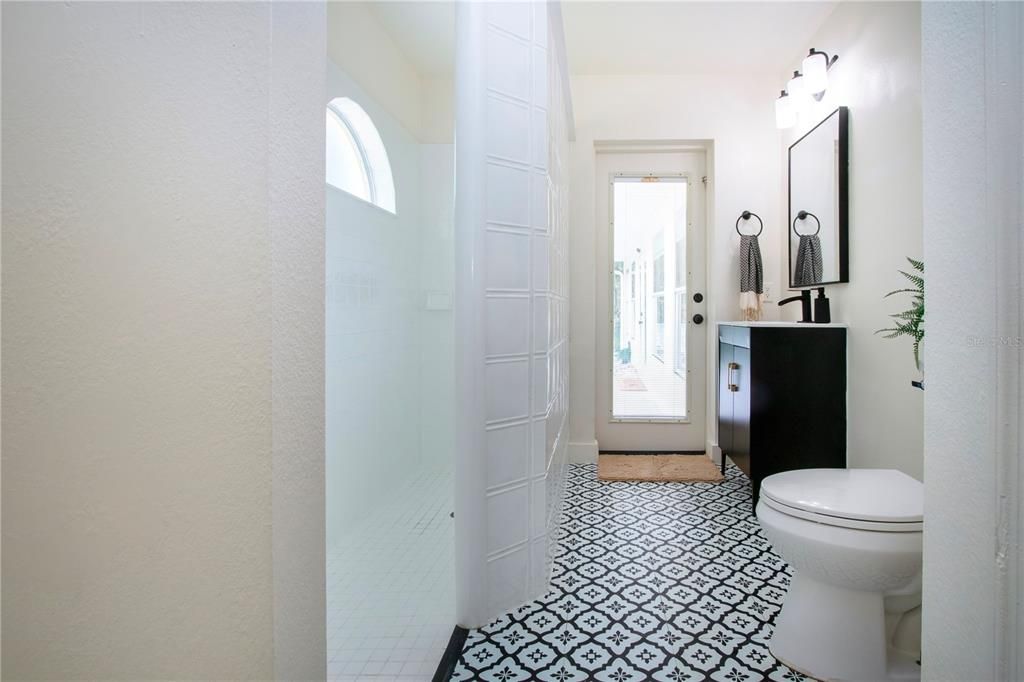 guest bathroom with an exterior door