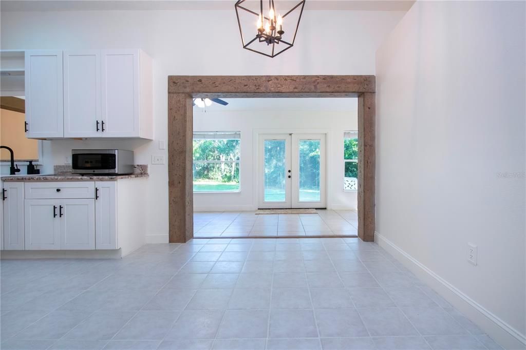 View of dining room and kitchen to the enclosed under air Florida room