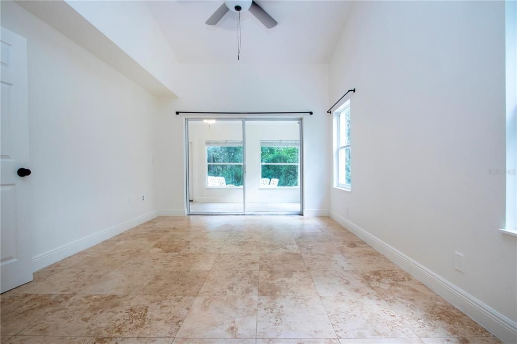 Owners Suite with sliding glass doors to the Florida room