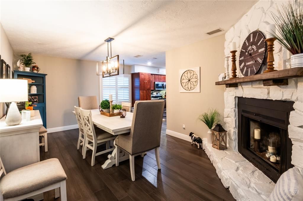 Dining room just off the kitchen, perfect for family meals with the bonus of the charming woodturning fireplace