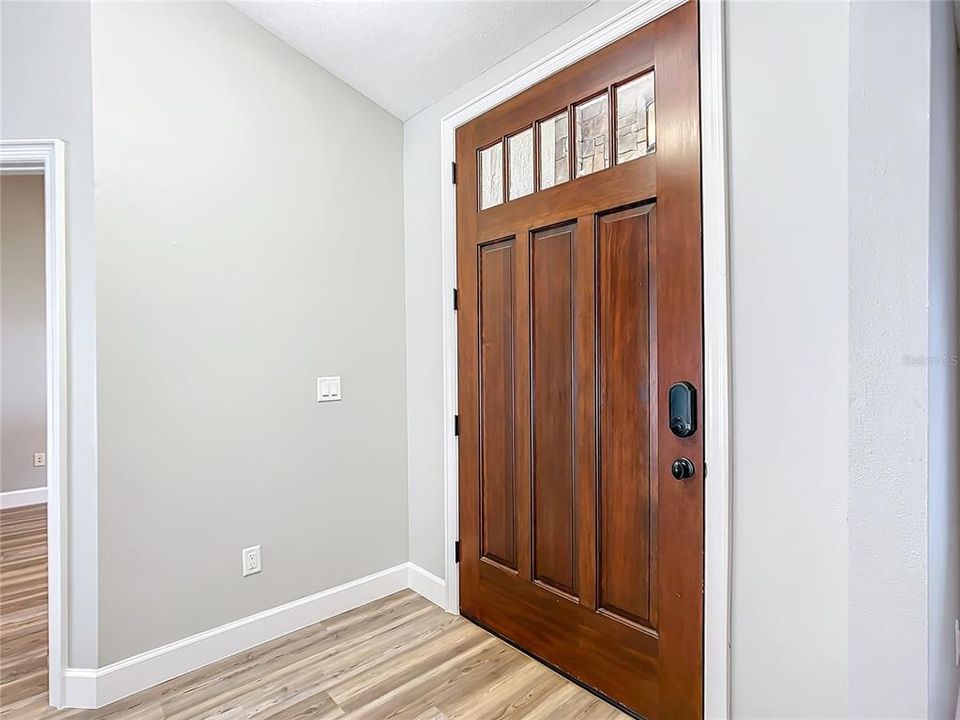 Four foot wide solid wood front door.