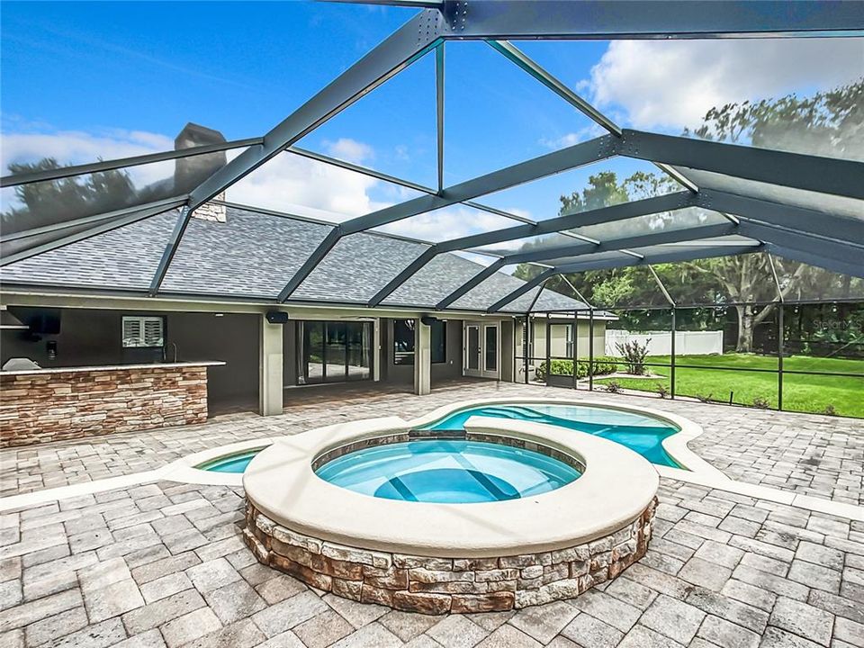 8 person hot tub with waterfall spillway.