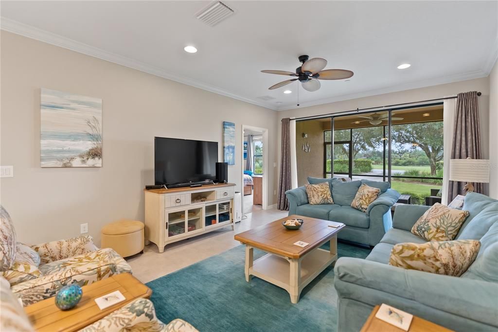 Living room over looking lanai and 10th hole