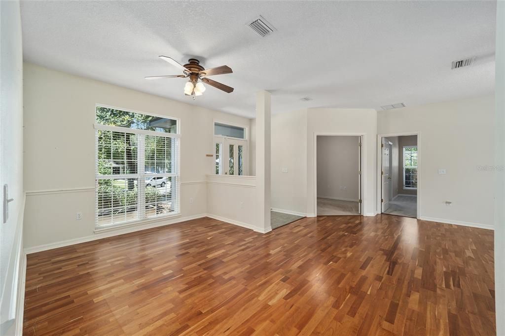 ANOTHER VIEW OF FORMAL DINING ROOM BACK TO FOYER AND STUDY