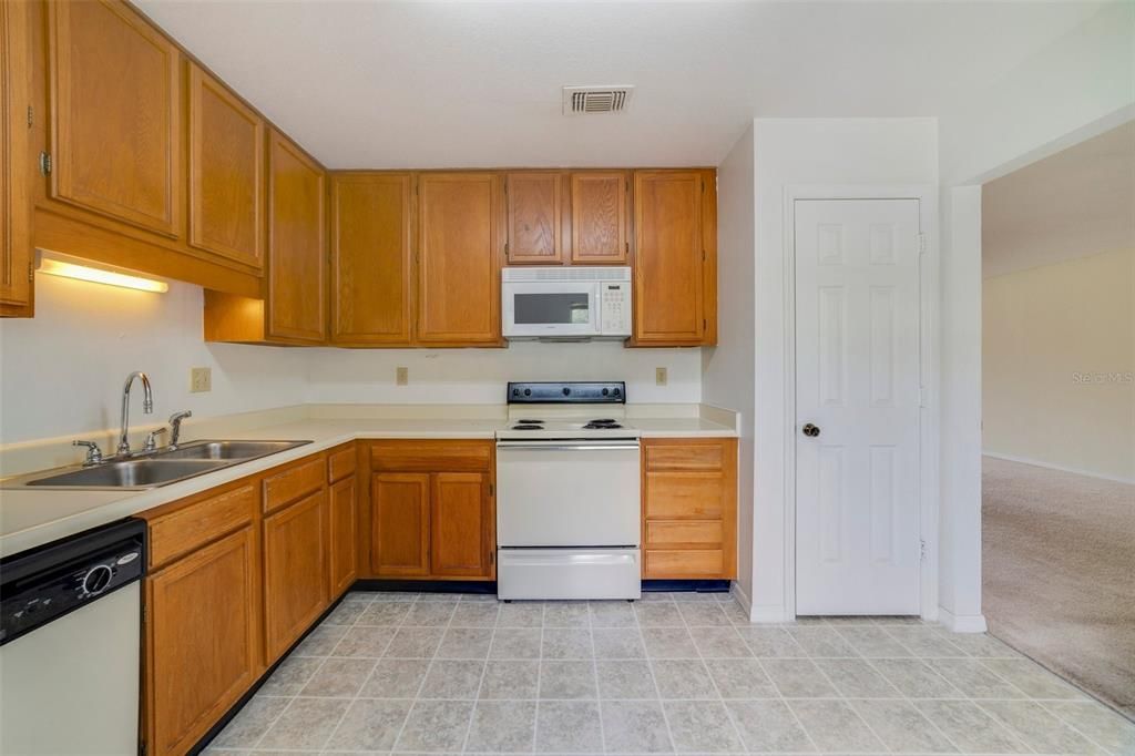 The comfortable kitchen has space to eat-in and a pantry for additional storage.