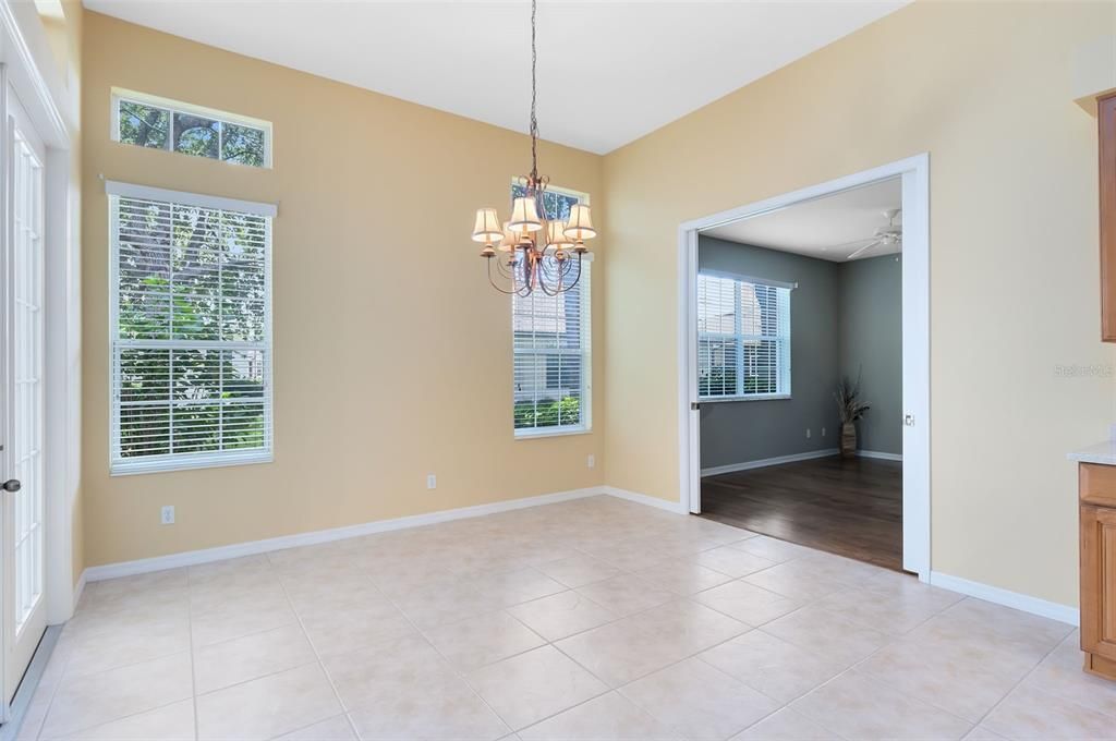 Large Dinette with french doors to coved, scxreen patio