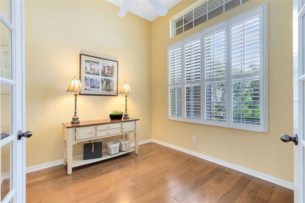 Front office or Den featuring double entry, high ceilings and Plantation Shutters!