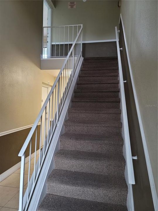 Stairs leading to top left unit