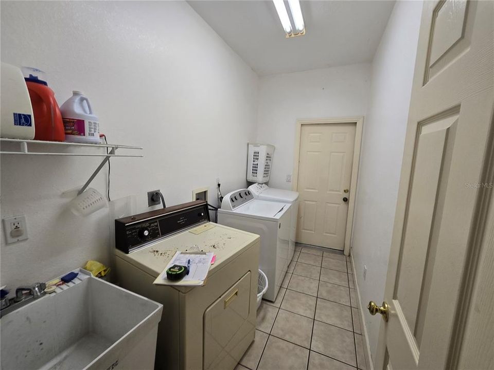 Hallway for laundry room opens to garage