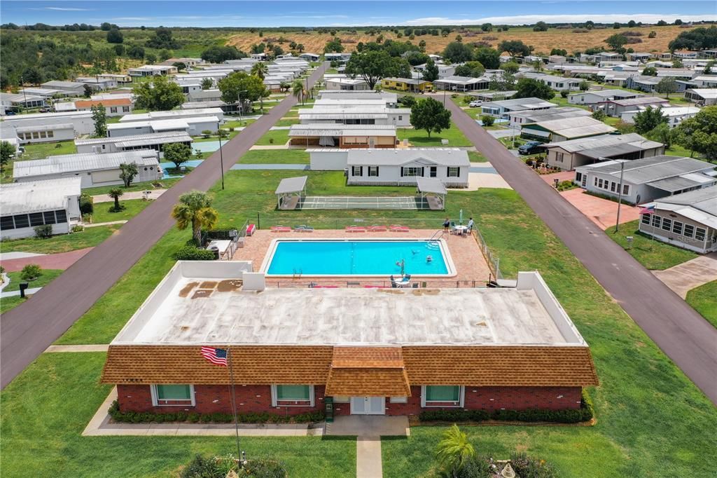 Aerial of clubhouse, pool and shuffleboard