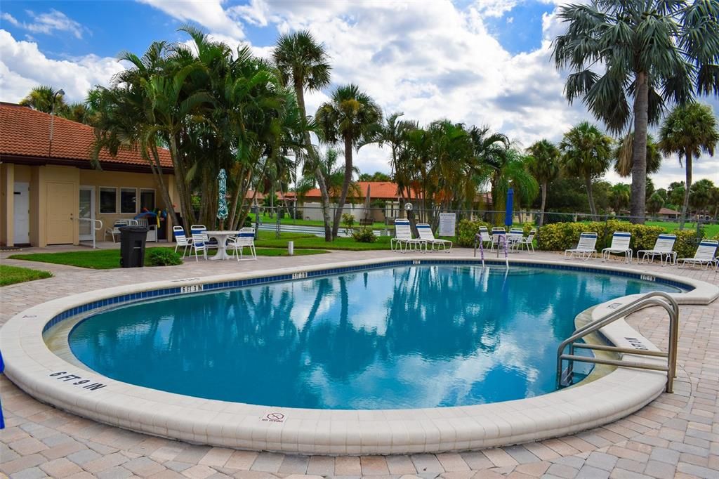 The heated pool backs up to the clubhouse.  There are outdoor restrooms and plenty of lounge chairs to relax read a book and get some sun.