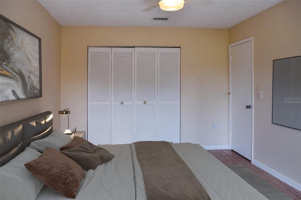 Virtually staged!  The large second bedroom opens up to the back patio.